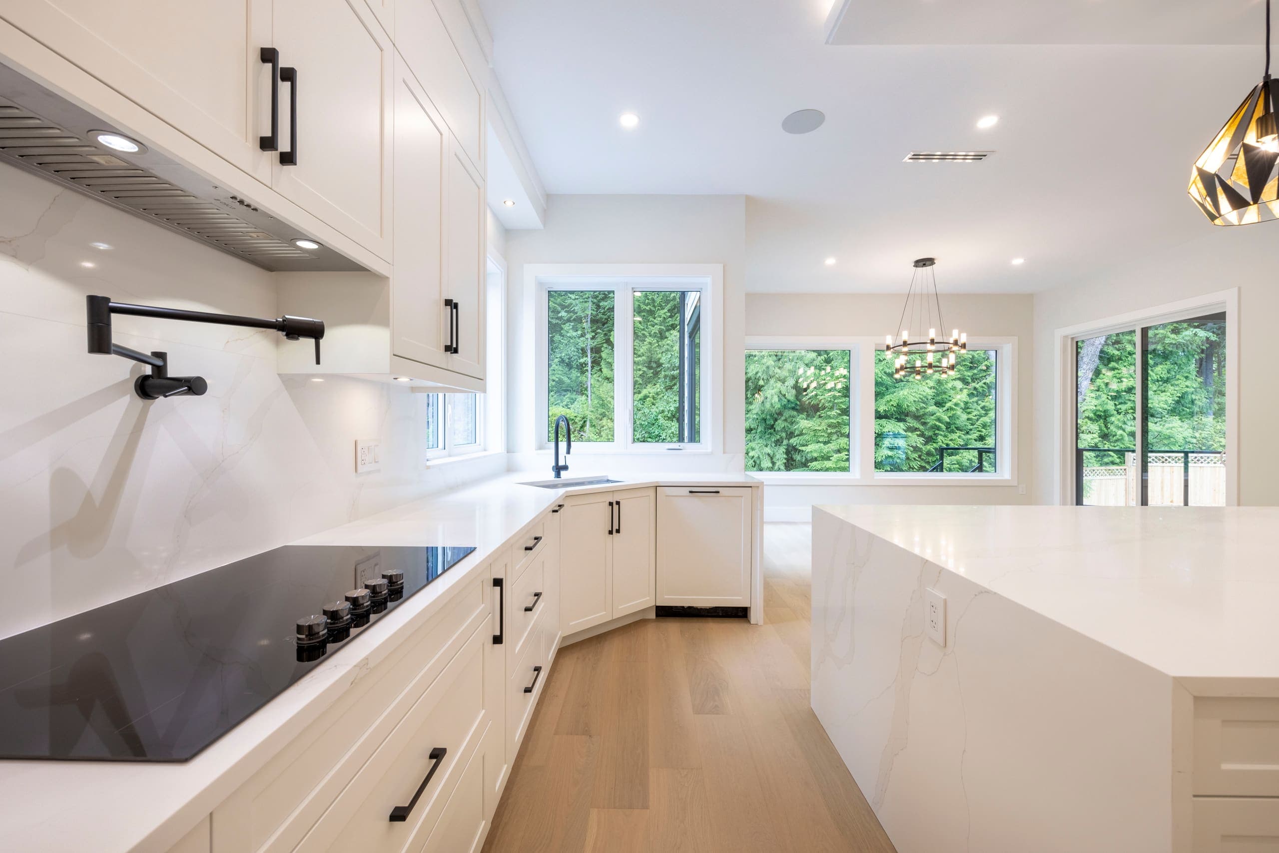 Working kitchen with gas cooktop and stone surround — The Monashee House