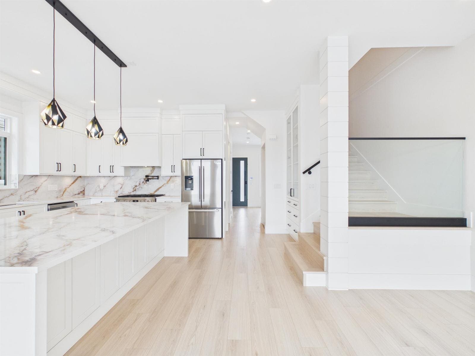 Kitchen looking back to the stair — The Pacific Douglas Duplex