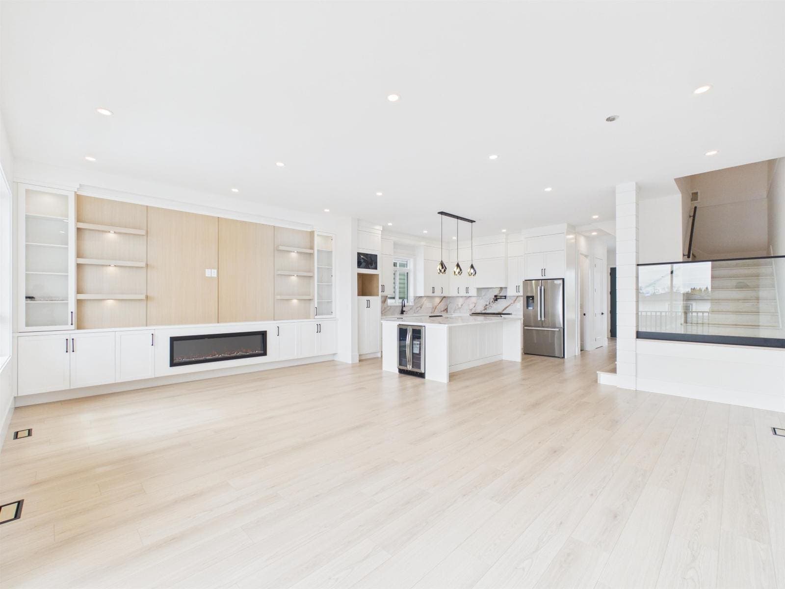 Living and dining, looking through to the kitchen and stair — The Pacific Douglas Duplex