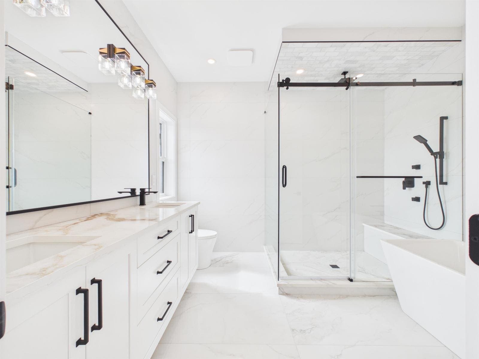 Five-piece principal ensuite with twin vanities and a freestanding tub — The Pacific Douglas Duplex