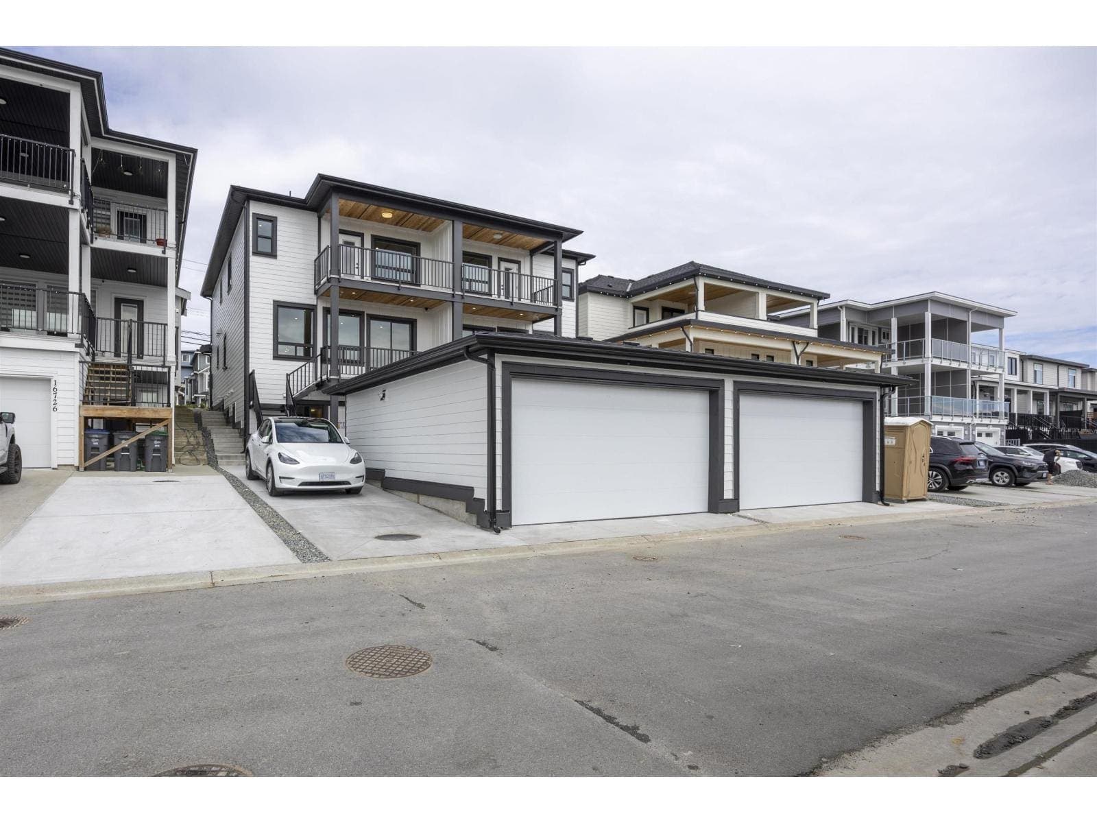 Rear elevation and garages from the lane — The Pacific Douglas Duplex